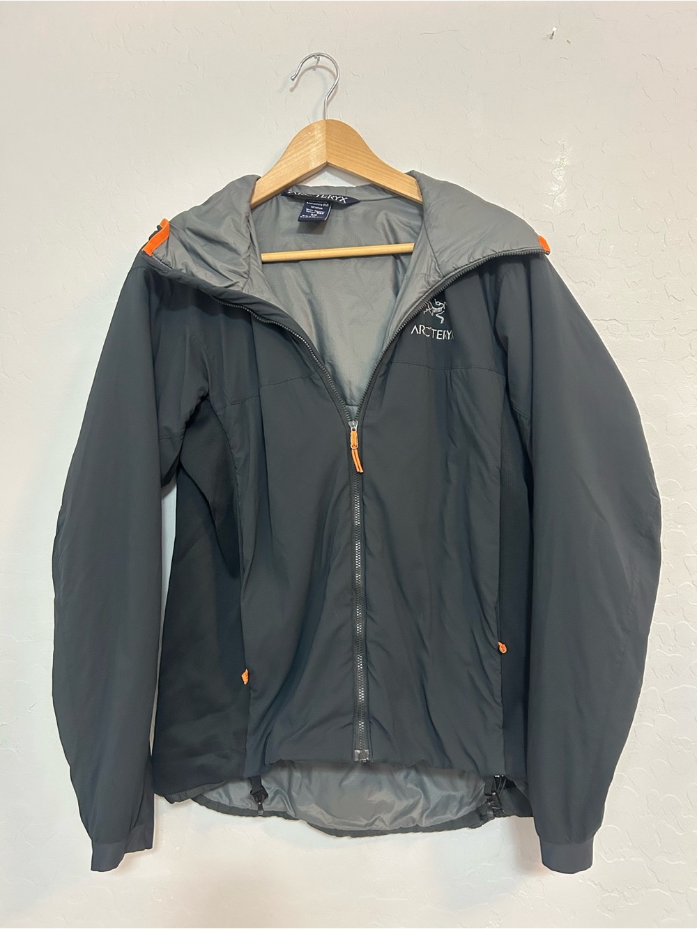Arc'teryx Women's Dark Gray Jacket with Orange AccentsA012